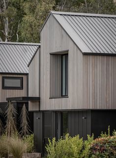 the house is made out of wood and has metal roofing on it's sides