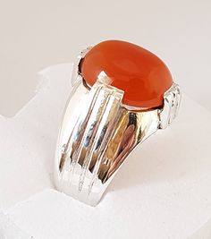 Natural Beautiful Orange Aqeeq Great carnelian Stone Big in Size. Real Stone From Yemen Handmade pure sterling silver 925 Ring with Beautiful Engraved Ring Ring size 8 US resize able as per buyer choice FedEx shipping option in same working day Note: there is no GOLD Color in the ring please consider all the ring is in Silver. It could be a camera effect Contact me in case of any question about the item Silver Rings With Polished Carnelian, Oval Agate Rings With Polished Finish, Oval Cabochon Agate Ring With Polished Finish, Polished Agate Oval Cabochon Rings, Silver Carnelian Rings With Polished Finish, Polished Carnelian Oval Rings, Silver Carnelian Signet Ring With Polished Finish, Oval Carnelian Gemstone Signet Ring, Oval Agate Hallmarked Rings