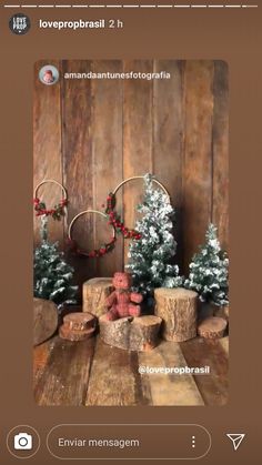 a wooden table topped with small christmas trees