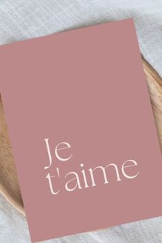 a pink card with the words je t'aime on it