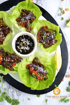 lettuce wraps with dipping sauce on a plate