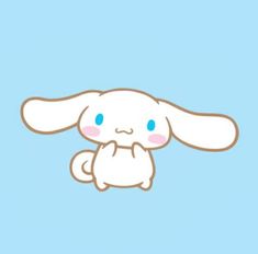 a white rabbit sitting on top of a blue background