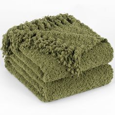 three green towels stacked on top of each other