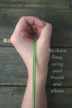 a hand holding a green string with the words re - skein floss, using your thumb and elbow