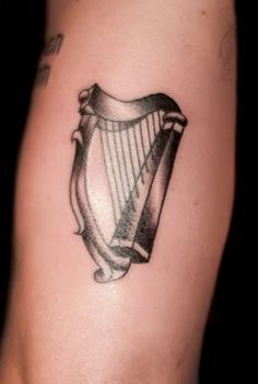 a tattoo with a harp on it