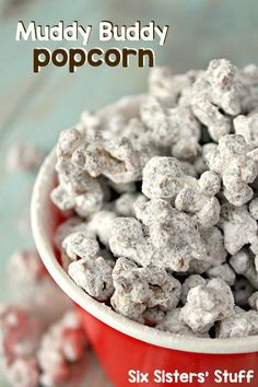 a white bowl filled with snowballs sitting on top of a table