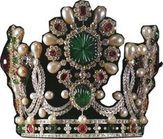 a tiara with pearls, emeralds and rubies on it's sides