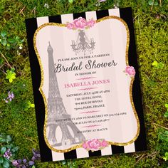 a pink and black bridal shower with the eiffel tower in the background