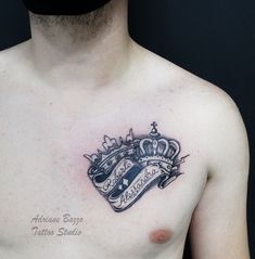 a man with a crown tattoo on his chest