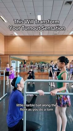 a woman is talking to a man in a ballet class