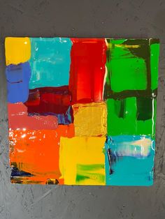 an abstract painting with multicolored squares on it