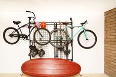 there is a bike rack with two bikes on it and a red table in the foreground