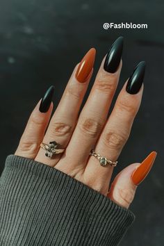 Get ready for fall with this stunning black and orange nail design! It's a perfect blend of bold and seasonal colors, making it easy to recreate. Whether you're a nail art beginner or pro, this look is sure to make a statement. Spooky Nail Inspo Almond, Fall Season Nails Coffin, Short Halloween Nails Orange And Black, Black Nails With Orange Chrome, Long Almond Acrylic Nails Halloween, Black Nails With Color Underneath, Halloween Nails Plain Colors, Black Orange Purple Halloween Nails, Matte Black And Orange Halloween Nails