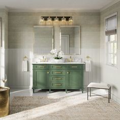 a bathroom with green cabinets and gold fixtures