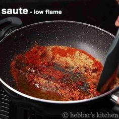 someone is frying some food in a pan on the stove with a spatula