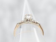 Say "yes" to this beautiful yellow and white gold diamond engagement ring with diamond accents! The dazzling ring will take your breath away and show your significant other just how much you care. This is sure to be a proposal they won't forget!Metal: 14K Yellow and White GoldGem: Diamond .19 Carats, SI2 in Clarity, H in ColorGem Measurements: 3.9 mm, RoundAccents: 4 Single Cut Diamonds totaling .05 Carats, SI in Clarity, H-I in ColorRing Size: 6Marks: "14K W WOCD" Stamped on the inside band Gold Diamond Engagement Ring, White Gold Diamond Engagement Ring, Ring With Diamond, Say Yes, Significant Other, Eternity Bands, Pearl Pendant, Charm Earrings, Beaded Chain