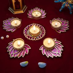 a table topped with lots of different types of candles