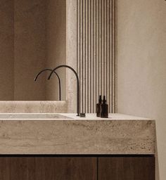 a bathroom sink with a faucet and soap dispenser