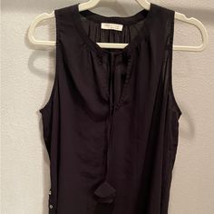 Never Worn. Ties At The Neckline. Button Detail At Each Hip. Black Sleeveless Blouse For Beach, Black Sleeveless Blouse With Button Closure, Black Sleeveless Tank Top With Button Closure, Button Detail, Sleeveless Top, Womens Tops, Tank Tops, Women Shopping, Black