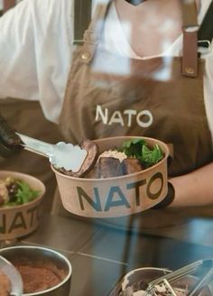 a person in an apron is preparing food