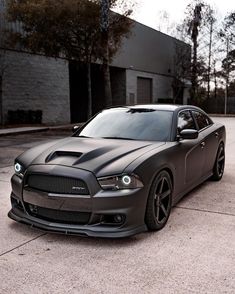 a black car parked in front of a building