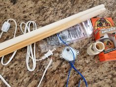 the contents of a baseball bat and other items are laid out on a counter top