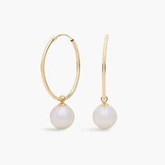 Go for a timeless look in these delicate hoop earrings crafted from 14k yellow gold. A lustrous freshwater pearl dangles elegantly from the bottom of each hoop. Classic Yellow Gold Huggie Earrings With Pearl Drop, Everyday 14k Gold Hoop Earrings With Pearl Charm, Classic Yellow Gold Pearl Earrings For Everyday Elegance, Classic Yellow Gold Pearl Earrings For Everyday, Timeless Yellow Gold Pearl Earrings For Everyday Elegance, Classic Pearl Charm Huggie Earrings For Anniversary, Classic Huggie Jewelry With Pearl Charm, Fine Jewelry Round Hoop Earrings With Pearl Drop, Fine Jewelry Pearl Drop Hoop Earrings