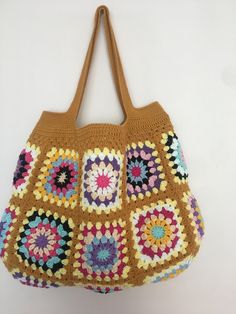 Mustard Color Crochet Granny Square Long Handle Shoulder Bag, Crochet Bag, Summer Bag, Crochet Totes, Granny Bag, Crochet Tote Bag Handmade This beautiful handmade bag 🌸 is perfect for completing your outfits. 55% Cotton - 45% Pac Light and handy Width: 45 cm - 17,3 inch Length: 33 cm - 12,9 inch Overall height with bag handle approximately : 55 cm - 21,6 inch There is one inner pocket. Dry cleaning recommended 🌸 Thank you so much 🌸 Brown Crochet Bag With Granny Square For Vacation, Brown Granny Square Crochet Bag For Vacation, Brown Hand-knitted Rectangular Bag, Everyday Brown Crochet Bag With Granny Square, Brown Crochet Tote Bag With Granny Square, Beige Granny Square Shoulder Bag, Brown Granny Square Crochet Tote Bag, Brown Square Crochet Bag With Granny Square, Brown Square Crochet Bag With Granny Square Design