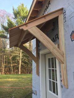 an image of a house being built with wood