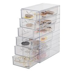 the drawers are filled with jewelry and other things to put in them for storage or display