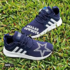 the new adidas cowboys shoes are laying in the grass