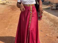 Cotton wrap skirt lined with handwoven Kente (the royal fabric of Ghana) Long Kente wrap ribbons --> one size Variant "red-Kente": red cotton, lined with classic Kente in yellow, blue, black, red pattern Variant "wine-blue": wine-red cotton, edged with light, dark blue and silver Kente Variant "blue-turquoise": royal blue cotton, edged with turquoise, yellow and purple patterned Kente Variant "black - Kente": black cotton, lined with classic Kente in yellow, blue, black, red pattern Variant "petrol-gold": petrol-coloured cotton, edged with gold and white Kente Variant "Pink-red": pink cotton, lined with pink, purple and beige patterned Kente Variant "blue-Kente": blue cotton, lined with classic Kente in yellow, blue, black, red pattern Variant "petrol-turquoise": petrol-coloured cotton, li Traditional Cotton Pleated Skirt, Traditional Long Cotton Wrap Skirt, Traditional Relaxed Maxi Skirt With Lining, Traditional Relaxed Lined Maxi Skirt, Traditional Flared Maxi Skirt, Traditional Relaxed Flared Maxi Skirt, Traditional Relaxed Fit Flared Maxi Skirt, Traditional Long Pleated Skirt, Traditional Long Flowy Wrap Skirt