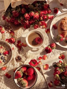 two bowls of oatmeal, strawberries and croissants on a table