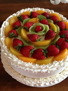 there is a cake with fruit on top