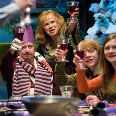 a group of people holding up wine glasses