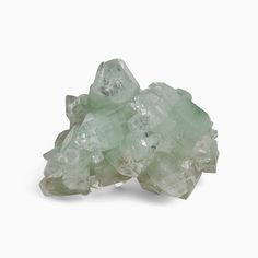 This radiant meditation crystal comes from Jalgaon, India, to energize your meditation practice and mindful approach to life. Ethically sourced, this Green Apophyllite Meditation Crystal is presented in a beautiful cluster shape of forms, reflections, and angles. Its green color is flecked with bits of red chalcedony and stilbite, which are all about calming that busy mind and feeling the love, among other traits. In addition to apophyllite’s rep for meditation and clarity, green apophyllite is Green Apophyllite, Balance Energy, Png Aesthetic, Diy Clothes Design, Meditation Crystals, Rock Collection, Green Quartz, Rose Quartz Crystal, Clear Quartz Crystal