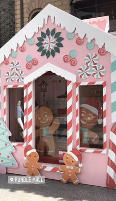 a large pink and white building with gingerbreads on it