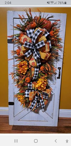 an image of a door decorated with fall decorations