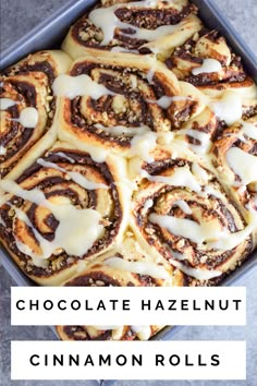 chocolate hazelnut cinnamon rolls with icing in a pan