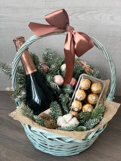 a basket filled with champagne and chocolates