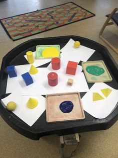 a black table topped with lots of different types of shapes and sizes on top of it