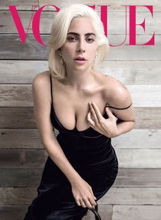 a woman in a black dress on the cover of a magazine with her hand on her hip