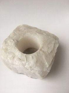 a small white object sitting on top of a table