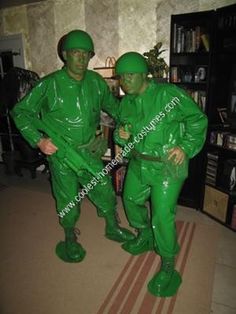 two men dressed in green standing next to each other