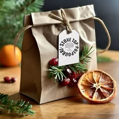 an orange slice sitting on top of a brown bag next to a piece of fruit