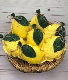 a wicker basket filled with yellow and green fruit