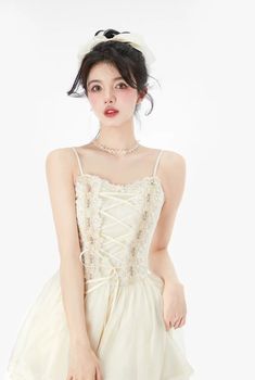 Size Chart 
 
 
 
 
 
 Size 
 
 
 Bust 
 
 
 Length 
 
 
 Waist 
 
 
 
 
 XS 
 
 
 76 
 
 
 77 
 
 
  62 
 
 
 
 
 S 
 
 
 80 
 
 
 79 
 
 
  66 
 
 
 
 
 M 
 
 
 86 
 
 
 81 
 
 
  70 
 
 
 
 
 L 
 
 
 90 
 
 
 83 
 
 
 74 
 
 
 
 
 
 There is 2-3 cm difference according to manual measurement. Please check the measurement chart carefully before you buy the item. Due to the light and screen, a slight color difference may be expected. Thank you for your understanding! Beige Balletcore Dress, Beige Balletcore Dress For Summer, Summer Balletcore Beige Dress, Feminine Beige Corset Dress, Cream Sleeveless Dress With Corset Back, Cream Sleeveless Corset Dress, Sleeveless Balletcore Dress With Lace Trim, Fitted Sleeveless Balletcore Dresses, Beige Dress With Boned Bodice