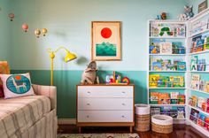 a child's room with toys and bookshelves