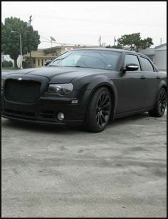 a black car parked in a parking lot