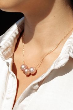 *Limited Edition* An unfailing new classic. This Triple Edison Floating Pearl Necklace is a steadfast companion. Seemingly plucked straight from the ocean, three near round pink pearls flutter along a delicate gold filled chain. This piece is striking solo or makes a bold statement layered with with a bevy of other beauties.✦ CHOOSE YOUR ADJUSTABLE LENGTH ✦✦ DETAILS ✦✧ Name: Lokelani (LOE keh LAH nee) - heavenly rose.✧ Three Large 12mm-13mm Natural Mauve Edison Pearl✧ Color will vary slightly. ✧ Elegant Pink Pearl Drop Necklace, Elegant Pink Pearl Necklace With Pendant, Elegant Pink Pearl Charm Jewelry, Elegant Pink Pearl Necklace For Anniversary, Luxury Pink Pearl Necklace For Wedding, Elegant Pink Akoya Pearl Necklace, Formal Pink Akoya Pearl Necklace, Formal Pink High Luster Necklace, Pink Akoya Pearl Necklaces For Wedding